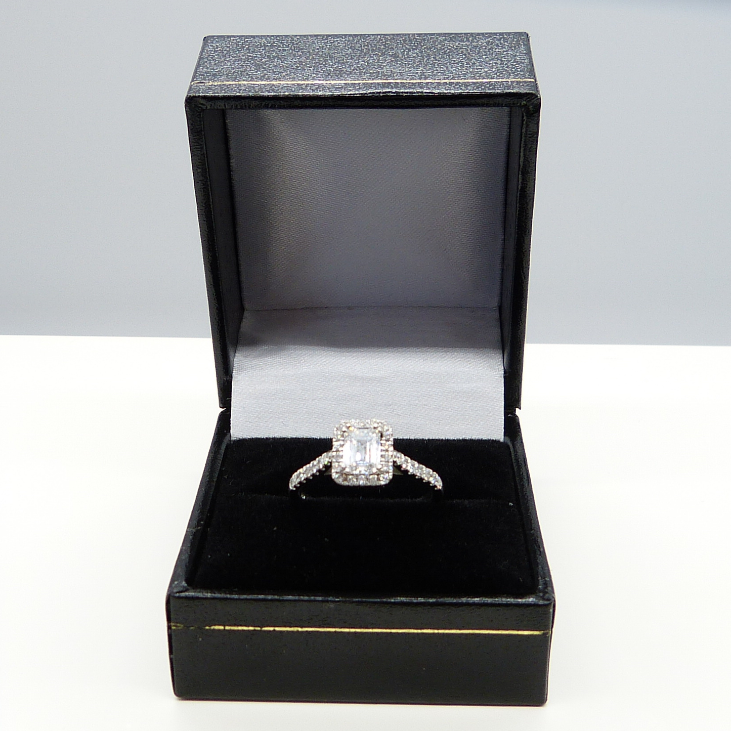 1.14CT EMERALD-CUT DIAMOND HALO RING