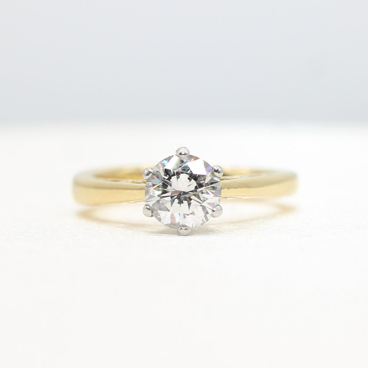 PLATINUM & YELLOW GOLD COLOURLESS 0.64CT DIAMOND SOLITAIRE RING