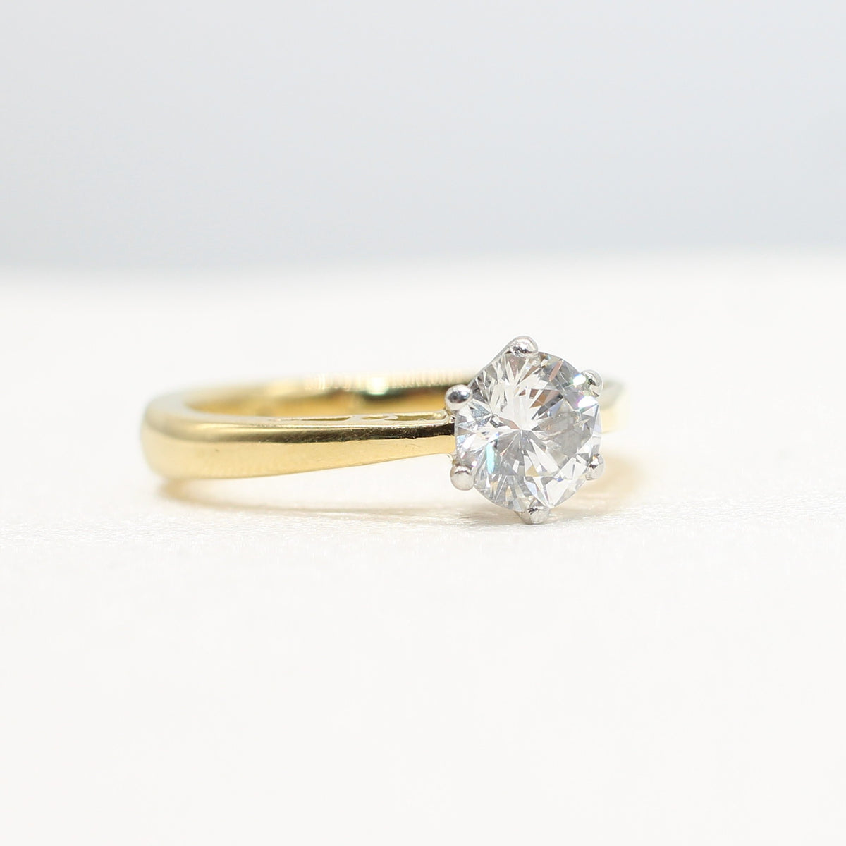 PLATINUM & YELLOW GOLD COLOURLESS 0.64CT DIAMOND SOLITAIRE RING