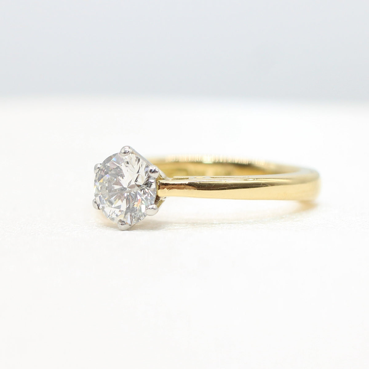 PLATINUM & YELLOW GOLD COLOURLESS 0.64CT DIAMOND SOLITAIRE RING