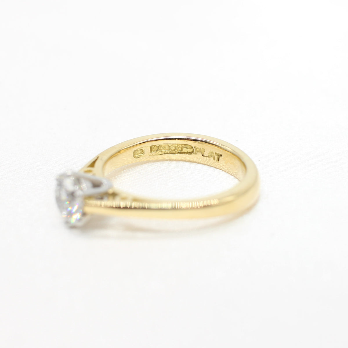 PLATINUM & YELLOW GOLD COLOURLESS 0.64CT DIAMOND SOLITAIRE RING